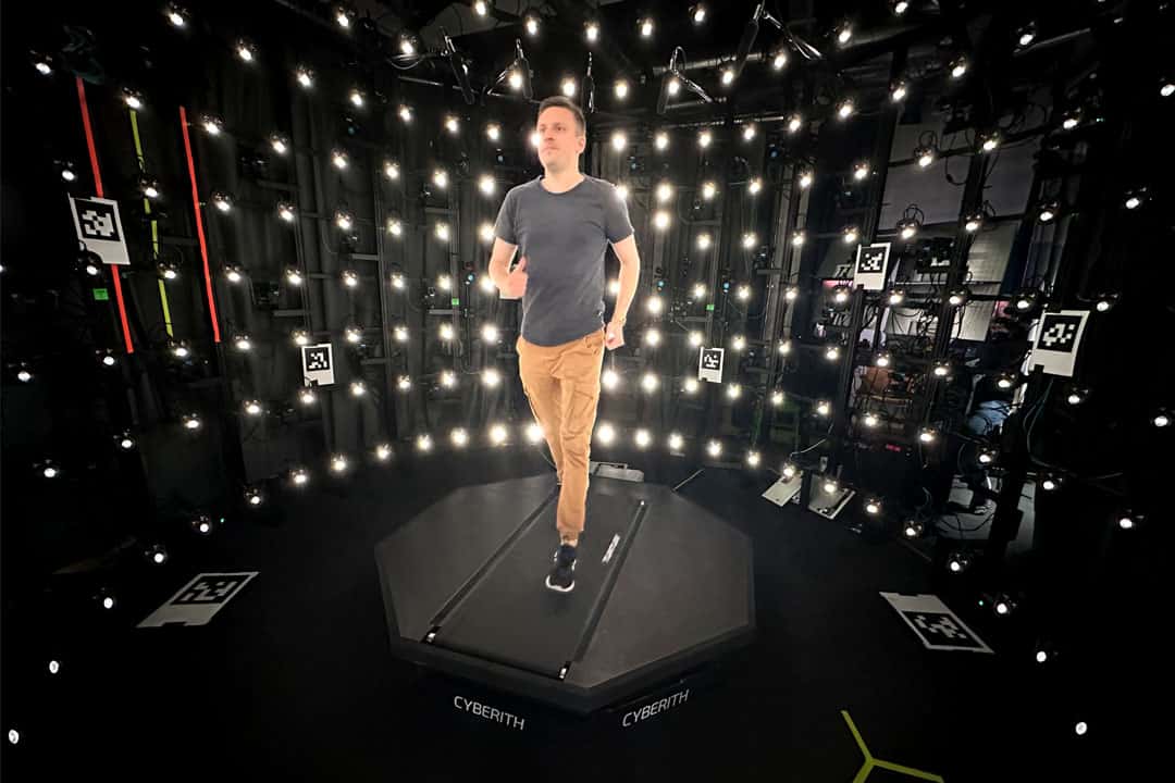 A user is walking on the VidMill within a Volumetric Capture rig